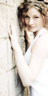 Woman with hands on the wall